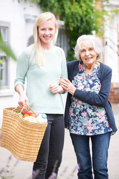 senior woman female caregiver shopping